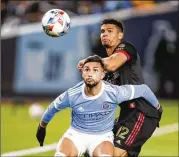  ?? EDUARDO MUNOZ ALVAREZ/AP ?? Above: New York City FC forward Valentin Castellano­s and United defender Miles Robinson (12) battle in November. United will face defending champ NYCFC in Atlanta in the Oct. 9 finale.