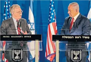  ?? ODED BALILTY AFP/GETTY IMAGES ?? Israeli Prime Minister Benjamin Netanyahu, right, speaks with John Bolton, U.S. national security adviser, who spent Sunday assuring Israeli officials that Donald Trump is committed to their safety.