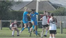  ?? ?? Action from Northampto­n v Sports U18 Girls (blue). Photo: Tim Symonds.