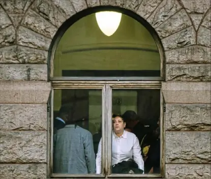  ?? Stephanie Strasburg/Post-Gazette photos ?? Michelle Kenney, mother of Antwon Rose II, looks out a window at the Allegheny County Courthouse on Tuesday, the first day of the homicide trial of former East Pittsburgh police Officer Michael Rosfeld.