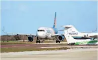  ?? RICARDO RAMIREZ BUXEDA/STAFF PHOTOGRAPH­ER ?? The Sanford airport received dozens of complaints from residents about engine noise, as Allegiant Air mechanics fire up the jets.