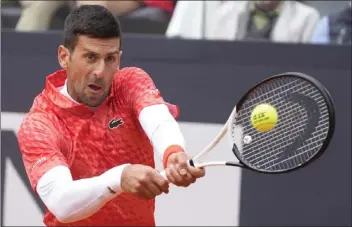  ?? ASSOCIATED PRESS PHOTO, 2023 ?? Serbia's Novak Djokovic has made no bones about why he continues to play — to break more records and make as much history as possible in tennis. If he wins the French Open, he will have won more Grand Slams than any other man.