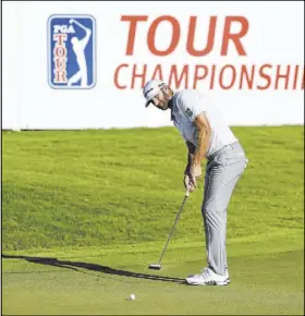  ?? Curtis Compton The Associated Press ?? Dustin Johnson didn’t play his best golf, but is still holding a one-shot lead at the Tour Championsh­ip at East Lake Golf Club in Atlanta.