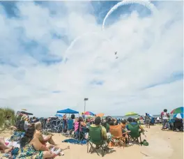  ?? KYLE TELECHAN/POST TRIBUNE E ?? The Aeroshell team loops over the crowd during the 2016 Gary Air Show.