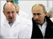  ??  ?? Putin and his chef: cooking up mischief?