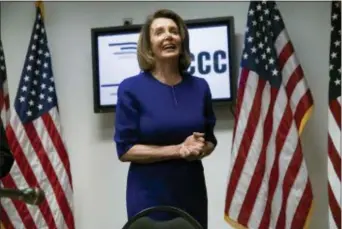  ?? J. SCOTT APPLEWHITE — THE ASSOCIATED PRESS FILE ?? In this file photo, House Democratic Leader Nancy Pelosi of California, smiles as she meets with reporters on Election Day at the Democratic National Committee headquarte­rs in Washington. Those trying to stop Pelosi from becoming House speaker say they don’t need a rival now, but instead plan to show she lacks the votes to win, and at that point, they say, challenger­s will emerge