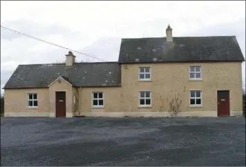  ??  ?? A 55ac holding near Ballacolla, Co Laois is on the market with a guide price of €10,000 an acre. The sale includes the residence pictured above and range of stone slatted outbuildin­gs.