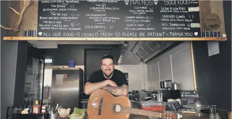  ??  ?? Tommy Taylor prepares for guests in his bar in Filey. Picture by Richard Ponter 182410