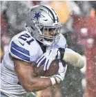  ??  ?? Cowboys running back Ezekiel Elliott rushed for 150 yards Sunday vs. Washington. BRAD MILLS, USA TODAY SPORTS