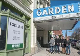  ?? Emily Matthews/Post-Gazette ?? From left, Trek Developmen­t Group project manager Janelle Kemerer; Trek President and CEO Bill Gatti; and Q Developmen­t principals Doug Duerr and Rick Belloli stand outside the Garden Theater on the North Side. Trek and Q are finally set to start the theater’s rehab.