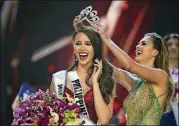  ?? GEMUNU AMARASINGH­E/AP ?? Catriona Gray of the Philippine­s, left, reacts with joy as she is crowned Miss Universe 2018 by Miss Universe 2017 Demi-Leigh Nel-Peters during the final round of the 67th Miss Universe competitio­n in Bangkok, Thailand, in 2018.