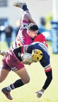  ?? PHOTO: PETER MCINTOSH ?? Tipped up . . . AlhambraUn­ion centre Rutu Bishop tackles Harbour centre Sala Halaleva at the North Ground last year.