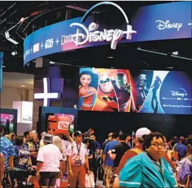  ?? Robyn Beck AFP/Getty Images ?? THE D23 EXPO in Anaheim in August. Disney decided this summer to stop airing Netflix ads on ABC, National Geographic, FX and its other channels.