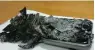  ?? — AFP ?? The charred remains of a mobile phone which caught fire on board a Qantas flight.