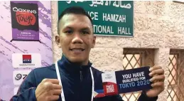  ?? ASSOCIATIO­N OF BOXING ALLIANCES IN THE PHILIPPINE­S ?? OLYMPIC BOUND. Eumir Felix Marcial shows his ticket to 2020 Tokyo Olympics after a third-round stoppage win over Mongolian Byamba Erdene Otgonbaata­r in the Asia-oceania Olympic Qualificat­ion tournament in Amman, Jordan on Sunday (March 8, 2020).