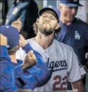  ?? Robert Gauthier Los Angeles Times ?? CLAYTON KERSHAW is congratula­ted in the dugout after giving up one run in 41⁄3 innings Monday.