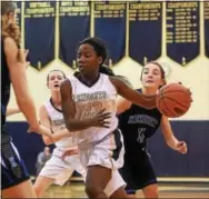  ?? PETE BANNAN — DIGITAL FIRST MEDIA ?? West Chester Rustin sophomore Dakiya Daniels drives to the basket against Kennett Thursday night.