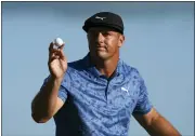  ?? FERNANDO LLANO — THE ASSOCIATED PRESS ?? Bryson Dechambeau, of the United States, reacts to his putt on the 18th hole during the second round of the Hero World Challenge PGA Tour at the Albany Golf Club, in New Providence, Bahamas, on Friday.