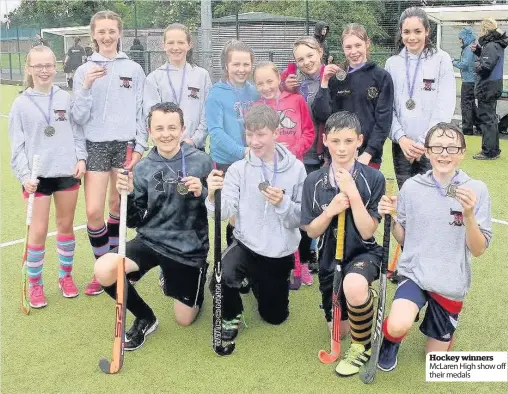  ??  ?? Hockey winners McLaren High show off their medals