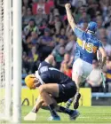  ??  ?? THREE N EASY: Seamus Callanan celebrates scoring against sorry Dubs