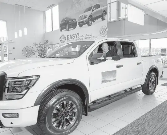  ?? CHONA KASINGER/THE NEW YORK TIMES ?? A Nissan Titan at Bill Korum’s dealership in Puyallup, Washington. Amid a shortage of new cars, buyers are turning to overlooked models and brands.