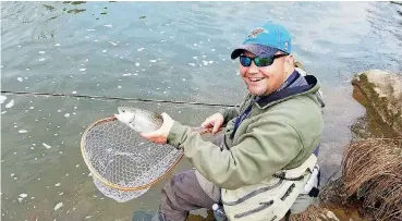  ?? [PHOTO PROVIDED] ?? Donovan Clary of Purcell holds a trout that he caught at the Blue River during this month’s Blue River Fly Classic. Clary won the tournament, which raises money to benefit the Blue River in southern Oklahoma near Tishomingo.