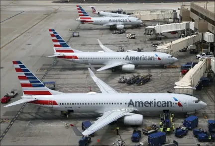  ?? ROSS D. FRANKLIN — THE ASSOCIATED PRESS ?? This Wednesday photo shows American Airlines planes at Phoenix Sky Harbor Internatio­nal Airport in Phoenix. American Airlines, Inc. reports earnings Thursday, July 25.