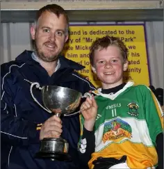  ??  ?? Johnny Murphy presents the cup to James Lawless.