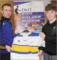  ??  ?? Patrick Johnston receives his All-Star jersey from Oisin McConville.