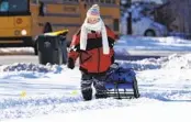  ?? NAM Y. HUH AP ?? A pedestrian bundles up against a frigid ice storm Tuesday in Rolling Meadows, Ill.