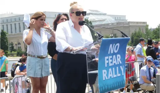  ??  ?? MEGHAN MCCAIN speaks at a rally against antisemiti­sm as Israeli actress Noa Tishby and Arizona State Rep. Alma Hernandez look on at the US Capitol in Washington, DC on Sunday. (Ron Kampeas)