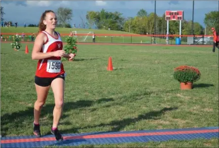  ?? SUBMITTED PHOTO ?? Vernon-Verona-Sherrill senior Delaney Brewer crosses the finish line at the 15th annual VVS Invite on Saturday, Sept. 7.