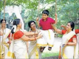  ?? VIVEK NAIR ?? A boy, dressed in traditiona­l attire, enjoys a swing ride as part of the Onam celebratio­ns in Kerala on Sunday. President Ram Nath Kovind and Prime Minister Narendra Modi greeted the people on the occasion.