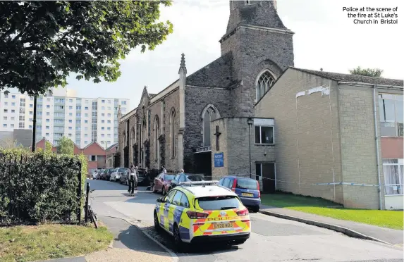  ??  ?? Police at the scene of the fire at St Luke’s Church in Bristol