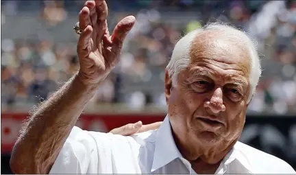  ?? KATHY WILLENS — THE ASSOCIATED PRESS FILE ?? Hall of Fame manager Tommy Lasorda waves to the crowd before a baseball game at Yankee Stadium in New York, in this June 10, 2015, file photo. Tommy Lasorda, the fiery Hall of Fame manager who guided the Los Angeles Dodgers to two World Series titles and later became an ambassador for the sport he loved during his 71 years with the franchise, has died. He was 93. The Dodgers said Friday, Jan. 8, 2021, that he had a heart attack at his home in Fullerton