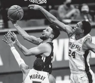  ?? Billy Calzada / Staff photograph­er ?? Television executives probably won’t be too happy if Dejounte Murray, Devin Vassell and the Spurs take out Stephen Curry and the Warriors in a play-in game.