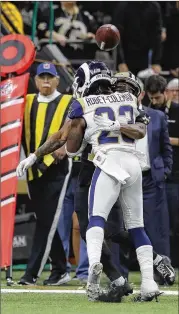  ?? CAROLYN KASTER / ASSOCIATED PRESS ?? Many were stunned Jan. 20 when officials didn’t penalize the Rams’ Nickell Robey-Coleman for flattening the Saints’ Tommylee Lewis before the ball arrived, reviving debate about challengin­g penalties.