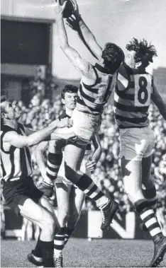  ??  ?? 1967: Chris Mitchell (8) almost spoils teammate Wayne Closter, watched by Magpie Ted Potter (left) and Cat Ken Newland.