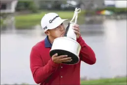  ?? AP photo ?? Kurt Kitayama kisses the trophy after winning the Arnold Palmer Invitation­al on Sunday.