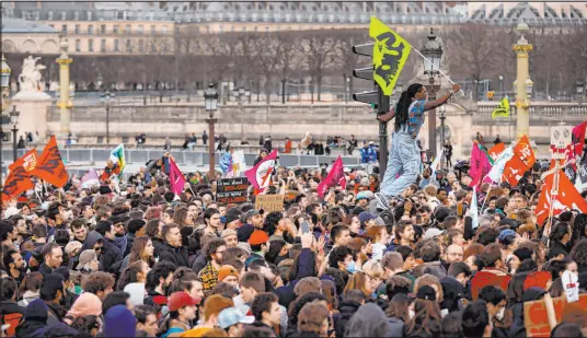  ?? Thomas Padilla The Associated Press ?? Protesters upset about the government’s pension reform gathered Thursday near the National Assembly in Paris.