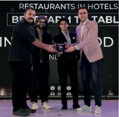  ?? ?? Ujjawal Dubey and Mahanaarya­man Scindia with chef Akshay Bhardwaj, head chef and Pushp Chauhan, director, restaurant operations at Andaz Delhi receive the award for AnnaMaya Andaz, the Winner in Best Farm-to-Table category.