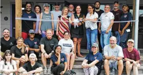  ?? Courtesy of GHBA ?? HomeAid and the GHBA’s Remodelers Council turned out for the final touch-ups on the constructi­on of two office spaces for SEARCH Homeless Services’ House of Tiny Treasures. The official ribbon-cutting was then held to dedicate the addition.