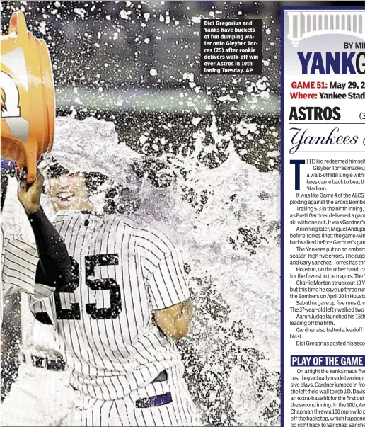  ??  ?? Didi Gregorius and Yanks have buckets of fun dumping water onto Gleyber Torres (25) after rookie delivers walk-off win over Astros in 10th inning Tuesday. AP