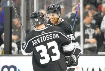  ?? Ashley Landis Associated Press ?? VIKTOR ARVIDSSON celebrates with Kings teammate Quinton Byfield after Arvidsson’s second goal of Thursday’s 5-4 win over the Chicago Blackhawks. It lined up a third straight playoff series with Edmonton.