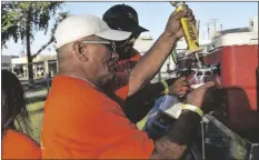  ?? PHOTOS BY CORISSA IBARRA ?? LEFT: Cold beer was also on the menu during the 3rd annual Taco Festival, held Thursday evening in Brawley.