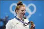  ?? PETR DAVID JOSEK — THE ASSOCIATED PRESS ?? Lydia Jacoby, of the United States, poses with the gold medal after winning the final of the women’s 100-meter breaststro­keat the 2020 Summer Olympics, Tuesday, July 27, 2021, in Tokyo, Japan.