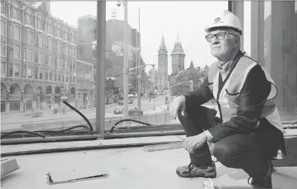  ?? PHOTOS: JULIE OLIVER ?? Architect Donald Schmitt checks on the progress of “the lantern,” the glass-tower centrepiec­e of the renovation to the National Arts Centre scheduled to open on Canada Day.