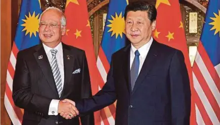  ??  ?? FILE PIC Prime Minister Datuk Seri Najib Razak and Chinese President Xi Jinping in Beijing in 2014. Malaysia can manage without Chinese foreign direct investment, but there is a difference between being prosperous and merely sustaining.