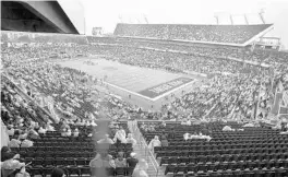  ?? STEPHEN M. DOWELL/ORLANDO SENTINEL ?? Spectators watch the Pro Bowl in the rain at Camping World Stadium on Jan. 27, 2019.