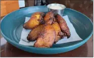  ?? (Arkansas Democrat-Gazette/Eric E. Harrison) ?? Don’t pass up the Fried Plantains — if you don’t get it as a side dish, consider it for dessert.